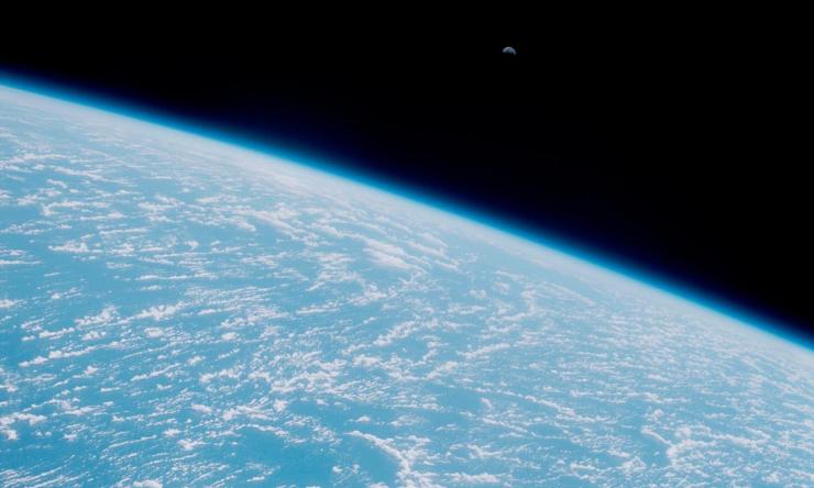 Photo of moon rise over the Earth taken from the Space Shuttle Discovery