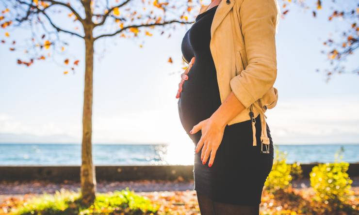 Pregnant mother walking outside