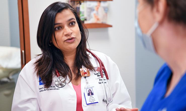 Dr. Utsavi Shah, OBGYN specialist, counsels a patient