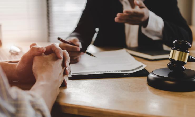 Two people in discussion at a table.