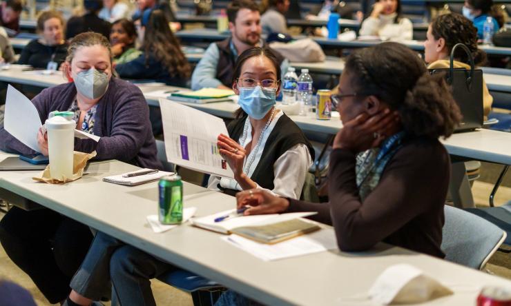 Trainee sitting at tables in a classroom
