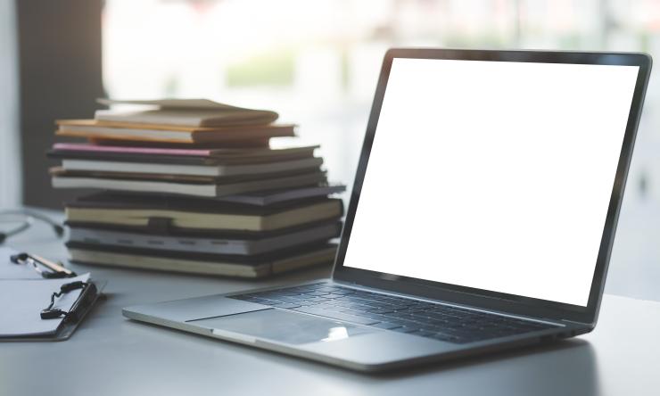 A laptop sitting on a desk.