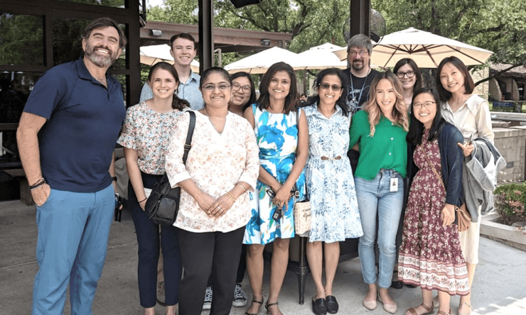 Wangler lab members smiling in a group outside
