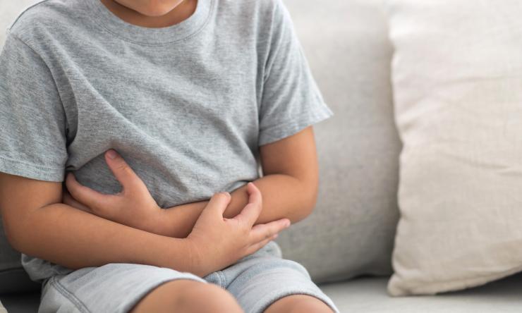Photo of child suffering from stomach ache