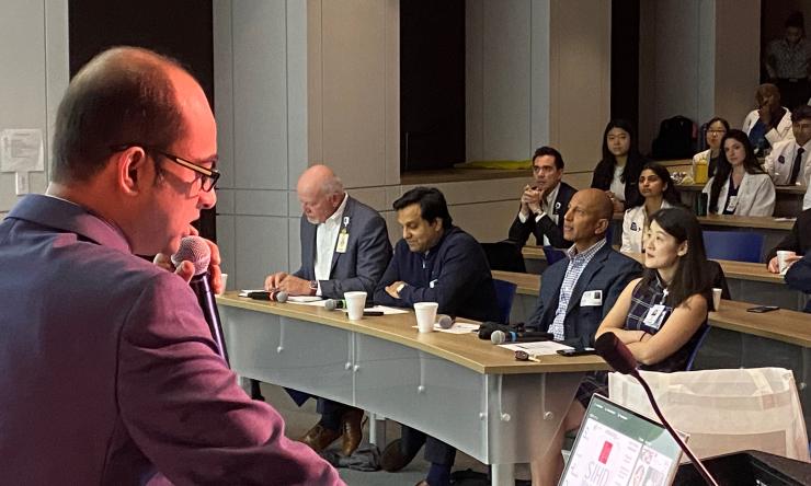 Dr. Nandan Mondal at a podium