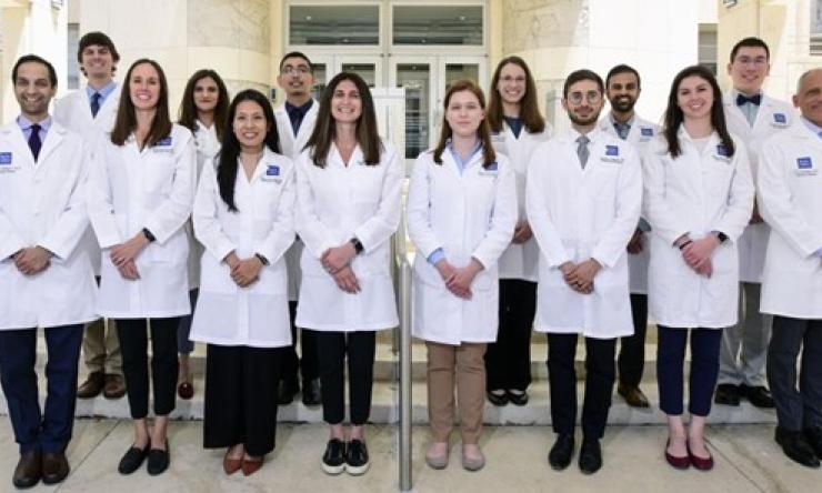 group of people in white doctor coats smiling