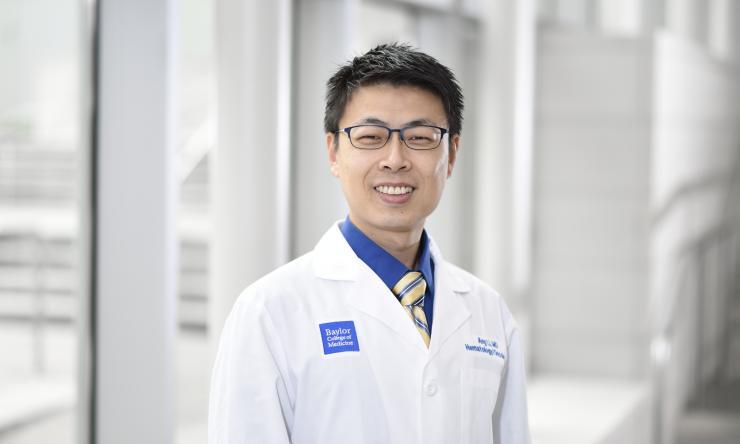 Photo of smiling doctor in white jacket.