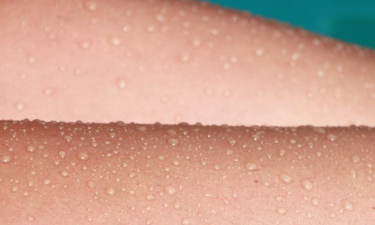 Close up photo of sweat on skin.