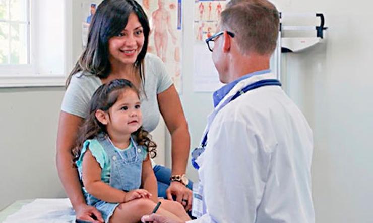 Image of Hispanic mother and child in a doctor's office