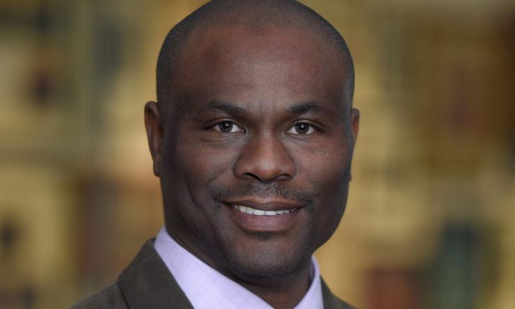 man with a red tie on smiling