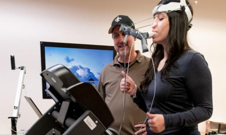 woman using a piece of medical testing equipment