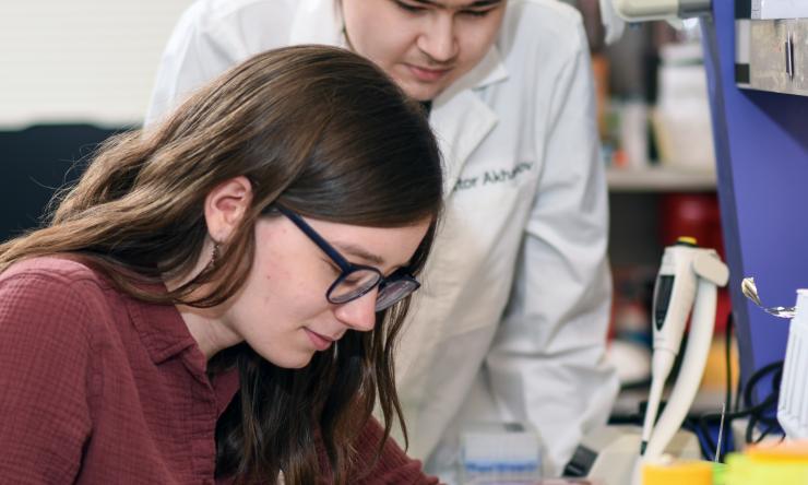Samuel lab members at their lab bench