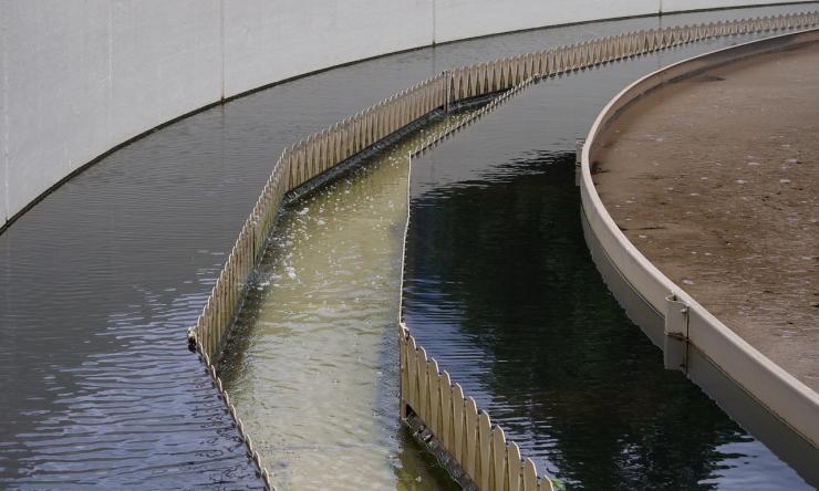 Photo of a wastewater treatment center, showing different shades of water