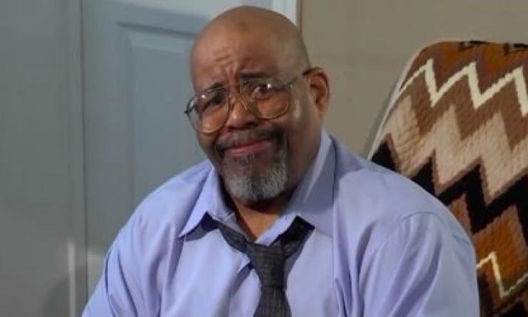 man with glasses on looking concerned