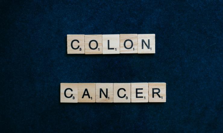 Colon Cancer spelled out in scrabble tiles.