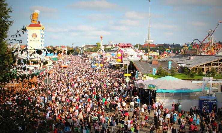 Photo of a large outdoor crowd at a fair