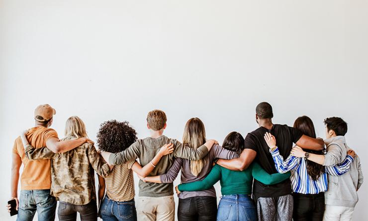 photo of a group of people standing next to each other