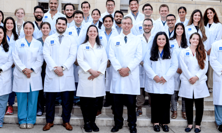 a group of doctors standing together and smiling