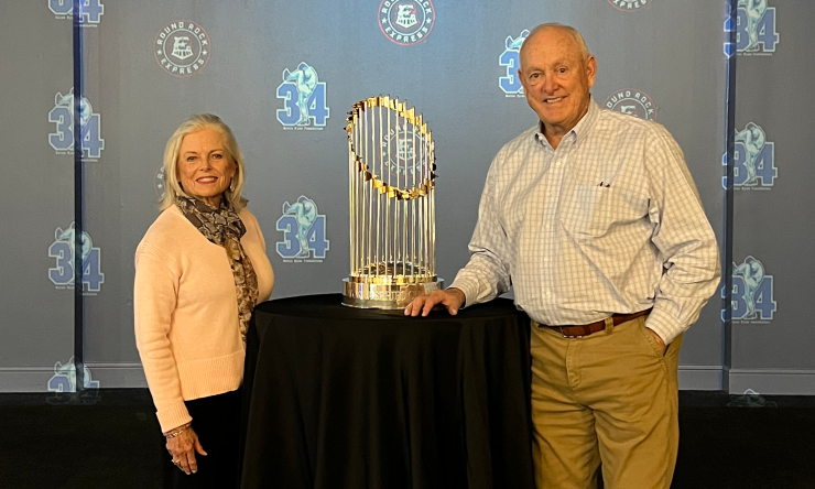 Nolan Ryan and his wife, Ruth, pose with a World Series trophy.