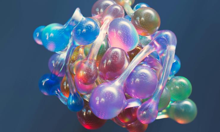 An artists rendition shows a "biological soup" of gene-regulating proteins. The current study shows that the noodle-like regions use a structured "bridge" protein to carry out gene activation.    