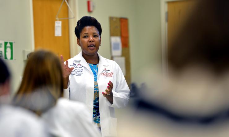 National School of Tropical Medicine faculty member teaching a in classroom lab.