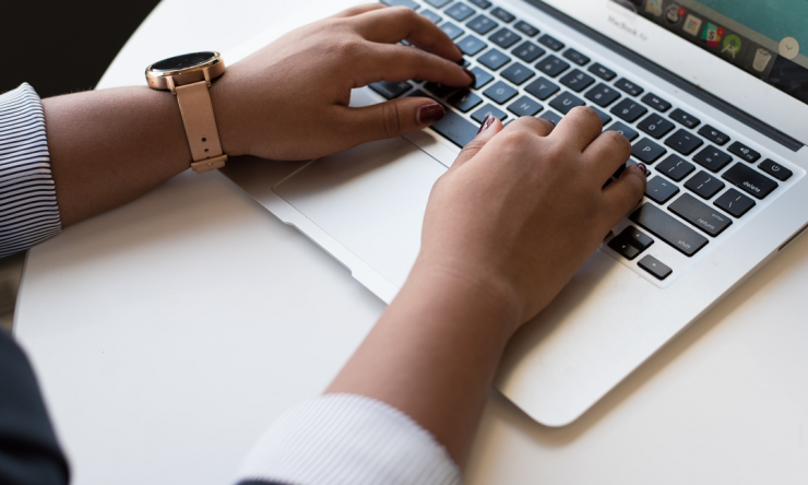 close-up of person using a laptop
