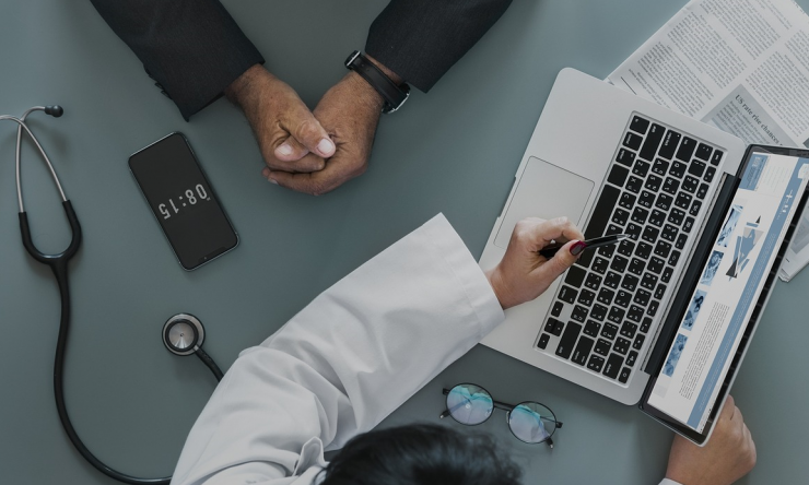 A doctor and patient in discussion during an appointment. 